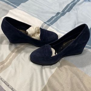 Dark blue sued wedge shoes.